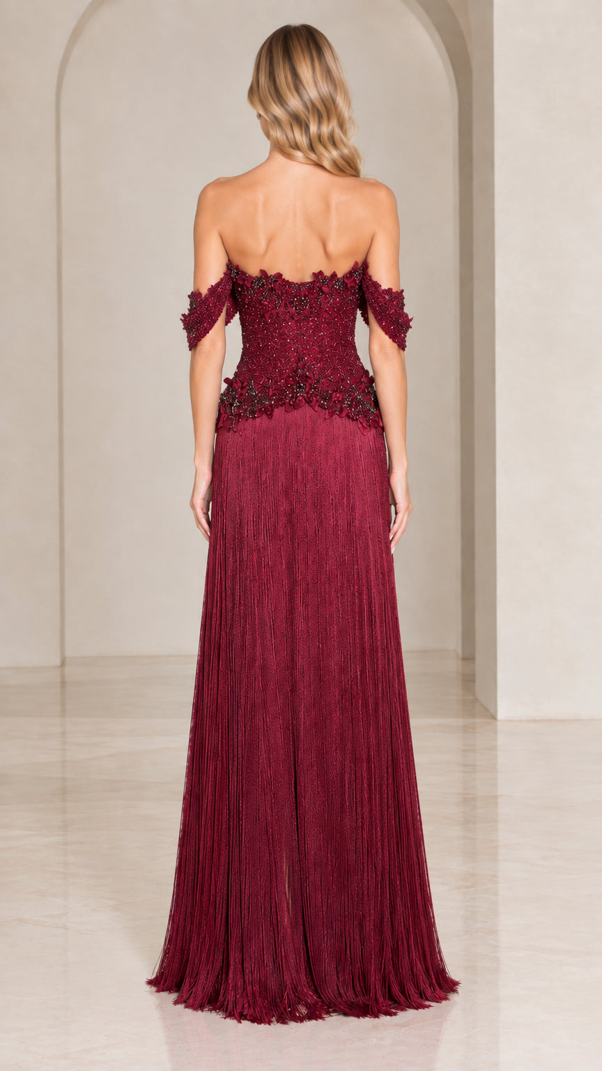 Back view of burgundy off-the-shoulder beaded formal gown with sweeping fringe