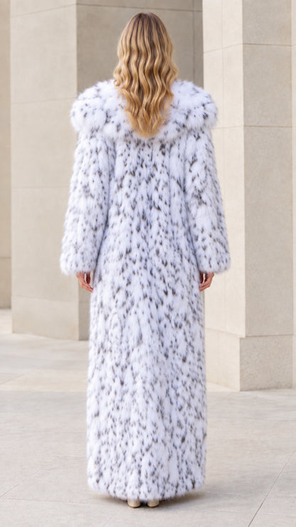 Back view of model in full-length snow white faux fur coat
