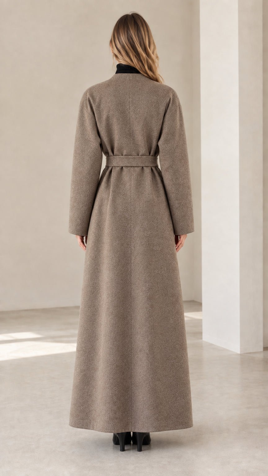 Back view of model in belted taupe maxi coat