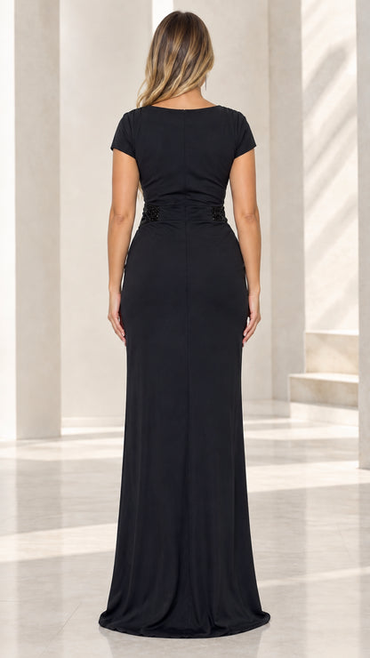 Back view of black fitted evening maxi dress showing smooth drape