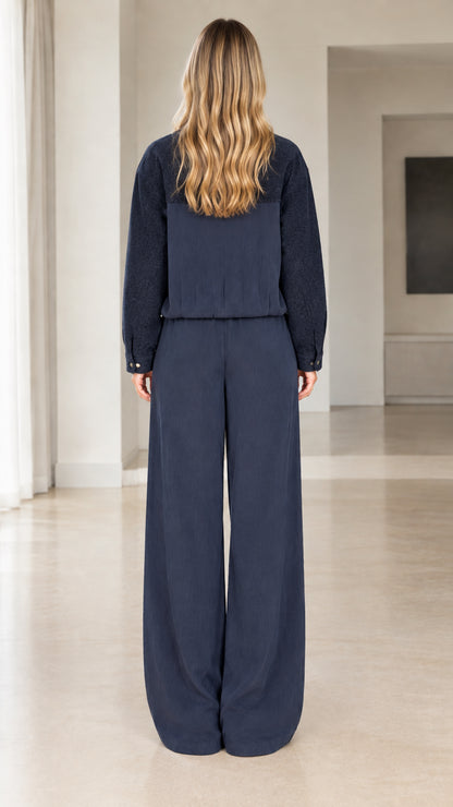 Back view of navy two-piece loungewear set featuring wide-leg pants