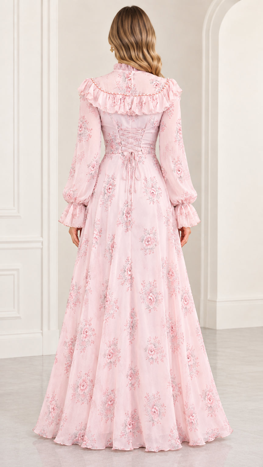 Back view of blush pink floral maxi dress showing ruffled back and lace-up corset ties