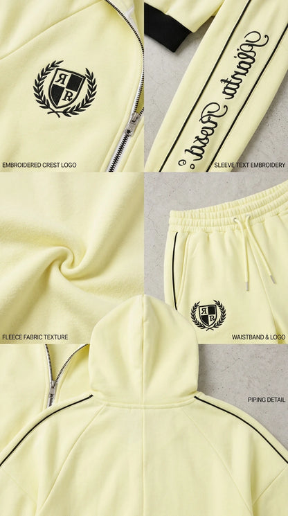 Close-up details of embroidered crest, sleeve script, fleece texture, and contrast piping