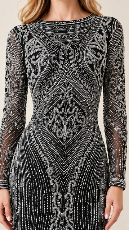 Close-up of intricate silver beadwork and boat neckline on black gown
