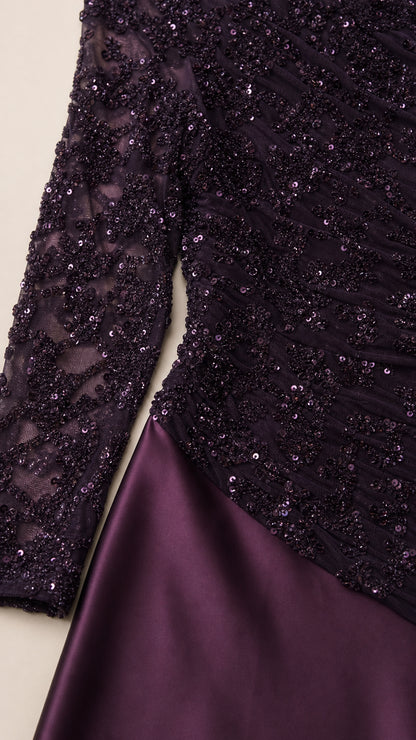 Close-up of plum beaded sequin lace bodice and smooth satin skirt texture