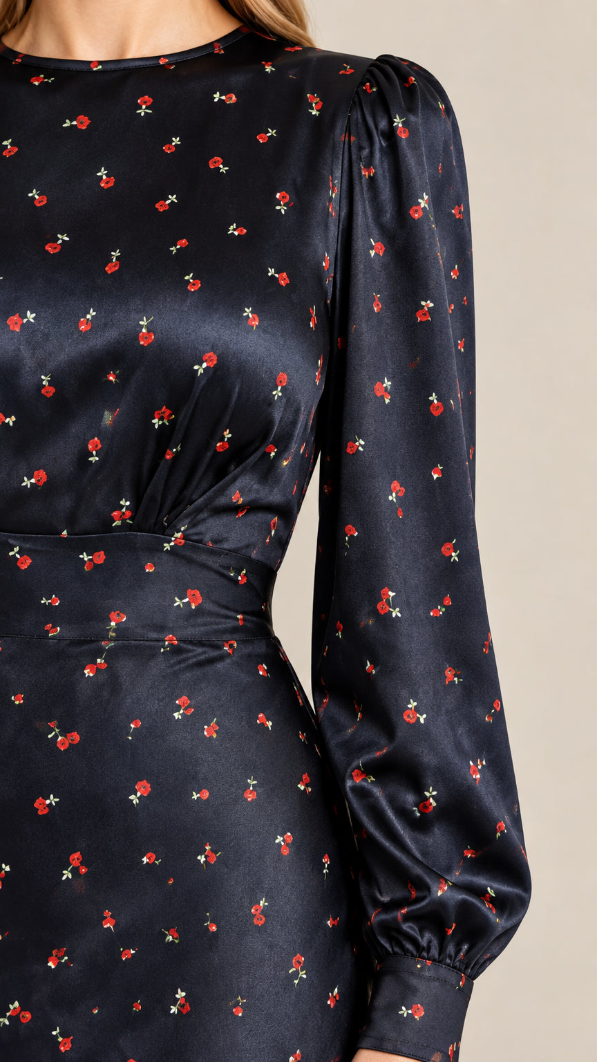 Close-up detail of bodice and bishop sleeve cuff in navy floral satin fabric