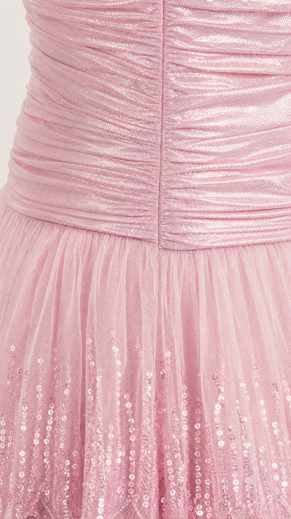 Close-up detail of ruched bodice and sequined tiered tulle skirt in blush pink