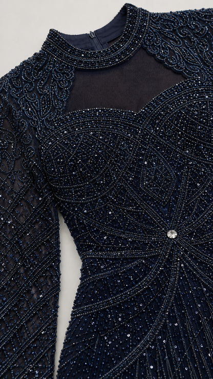 Close-up detail of sheer illusion neckline and intricate navy beadwork