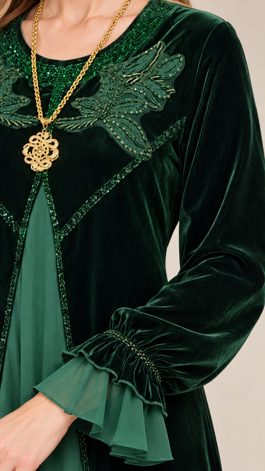 Close-up of beaded leaf embroidery and chiffon ruffle cuffs on dark green velvet