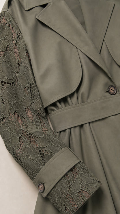 Close-up detail of Olive Green floral lace sleeve and trench storm flap