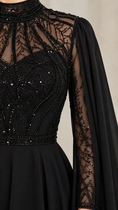 Close-up detail of high collar, intricate beading, sequins, and sleeve construction on black gown