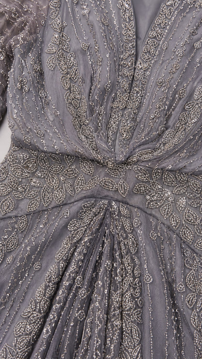 Close-up detail of intricate beading and sequin embroidery on slate grey bodice