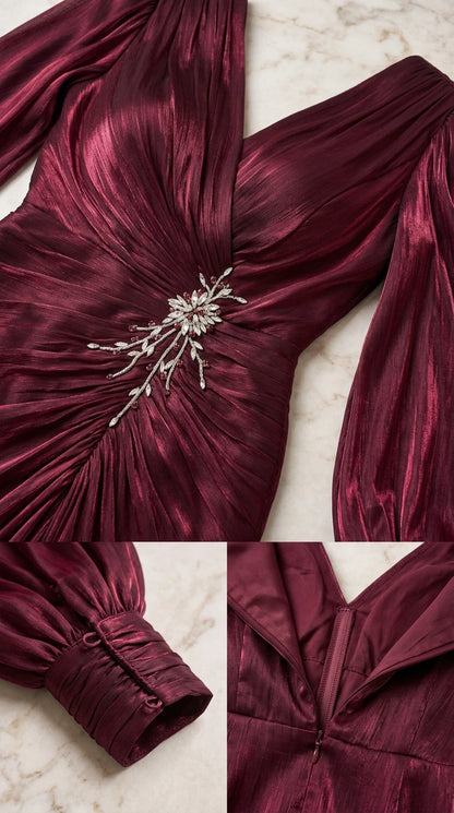Close-up details of burgundy dress showing pleated bodice, crystal brooch, buttoned sleeve cuffs, and back zipper