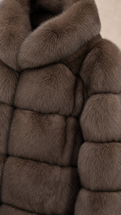 Close-up detail of plush faux fur texture and stand collar in taupe