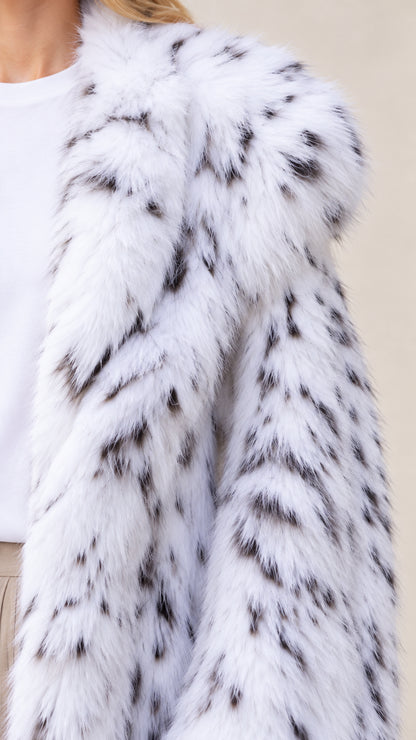 Close-up detail of plush speckled faux fur lapel and texture