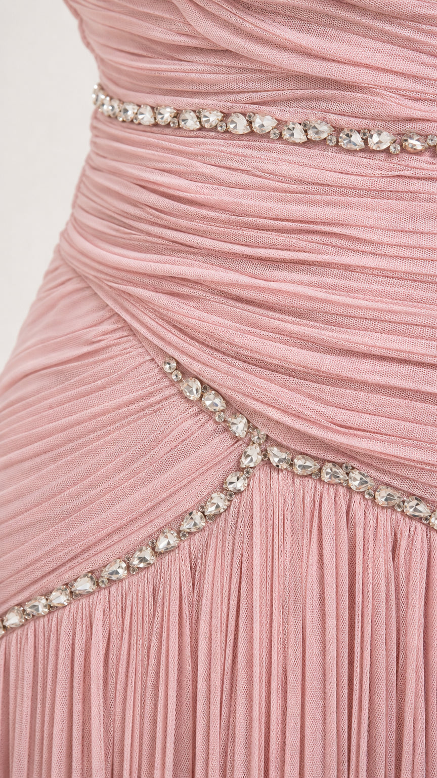 Close-up detail of pleated dusty pink chiffon bodice with sparkling rhinestone trim