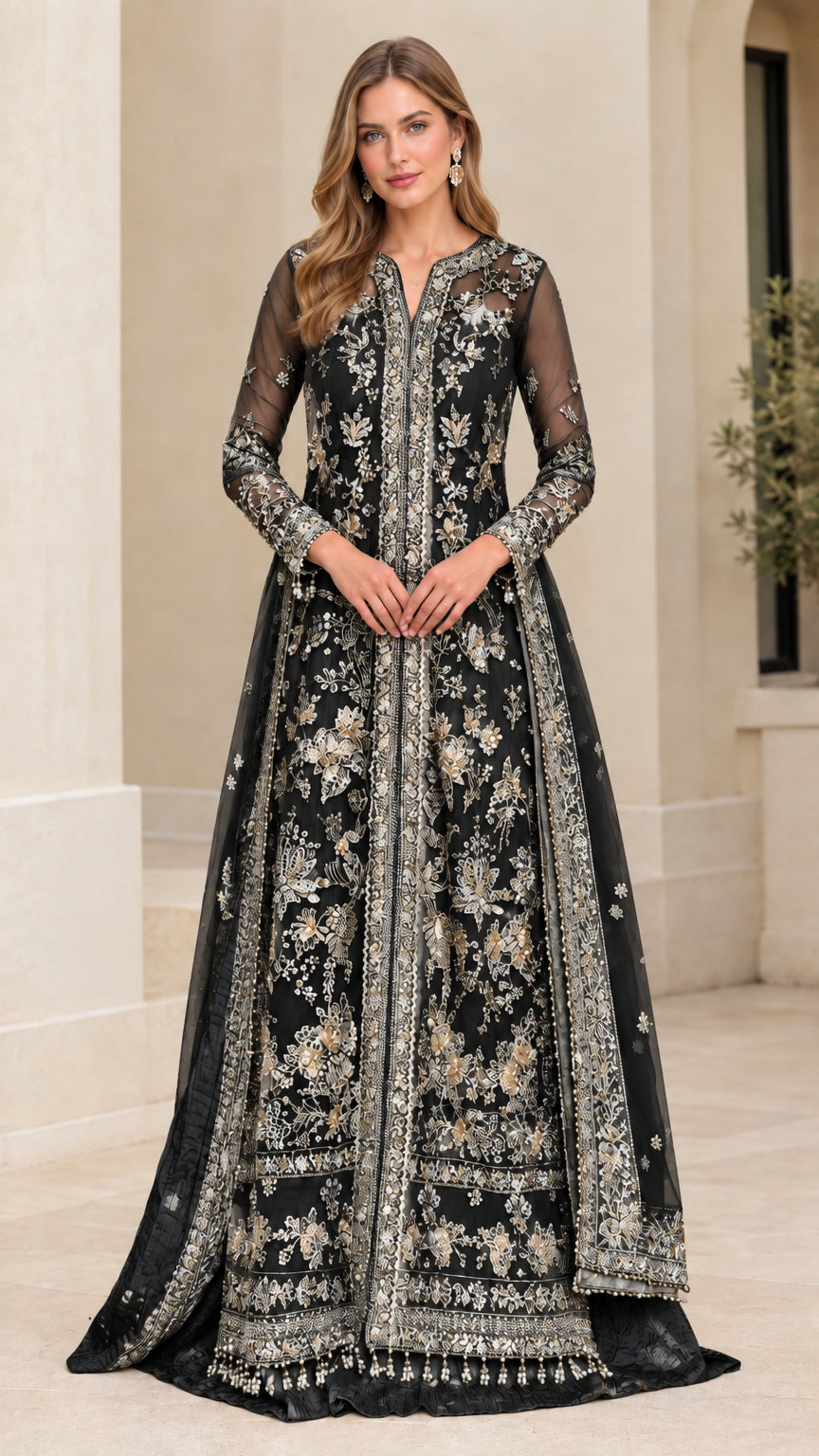 Model wearing black and gold embroidered long sleeve evening gown with beaded fringe