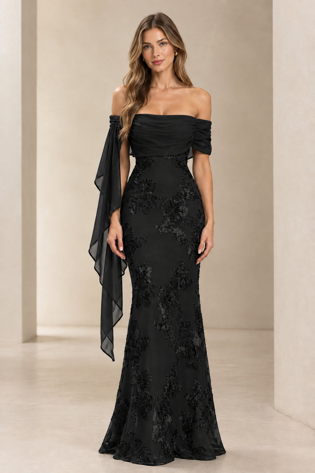 Model wearing black off-the-shoulder floral lace embroidered formal evening gown