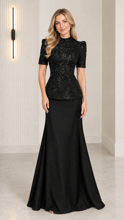 Front view of model wearing Black beaded peplum evening gown