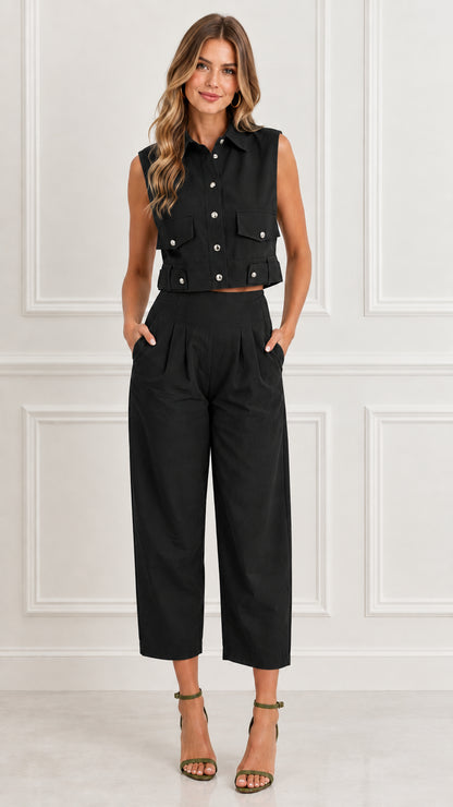 Front view of woman wearing Black sleeveless utility crop top and matching pant set