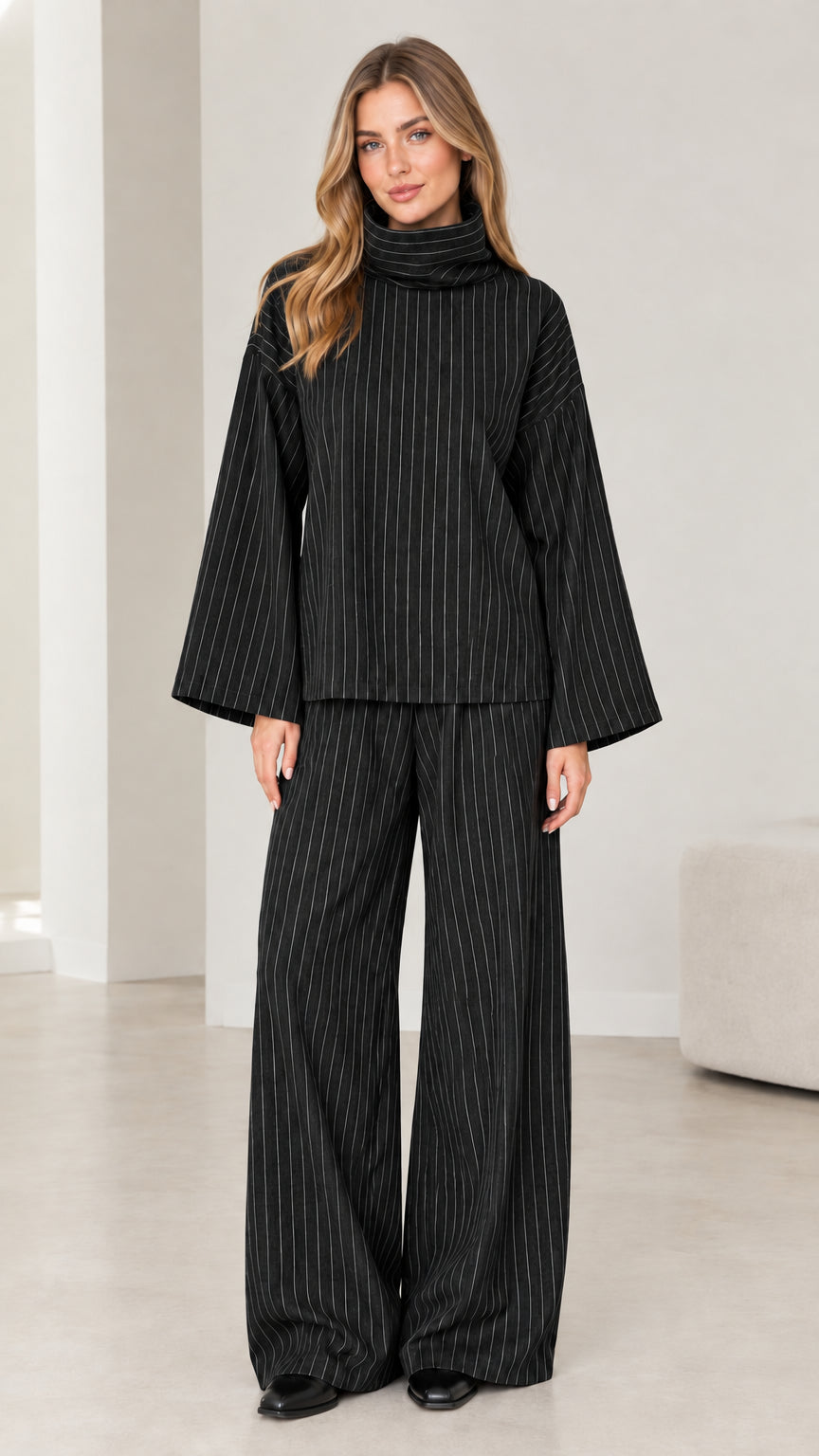 Woman wearing Black pinstripe turtleneck top and matching wide-leg trousers set
