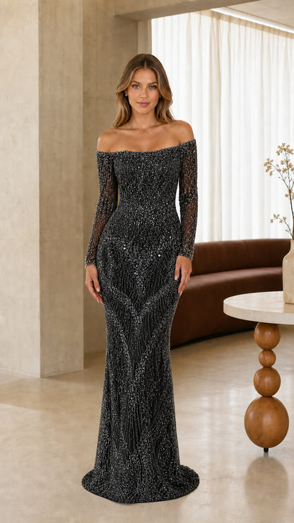 Full-length front view of model wearing black off-the-shoulder beaded evening dress