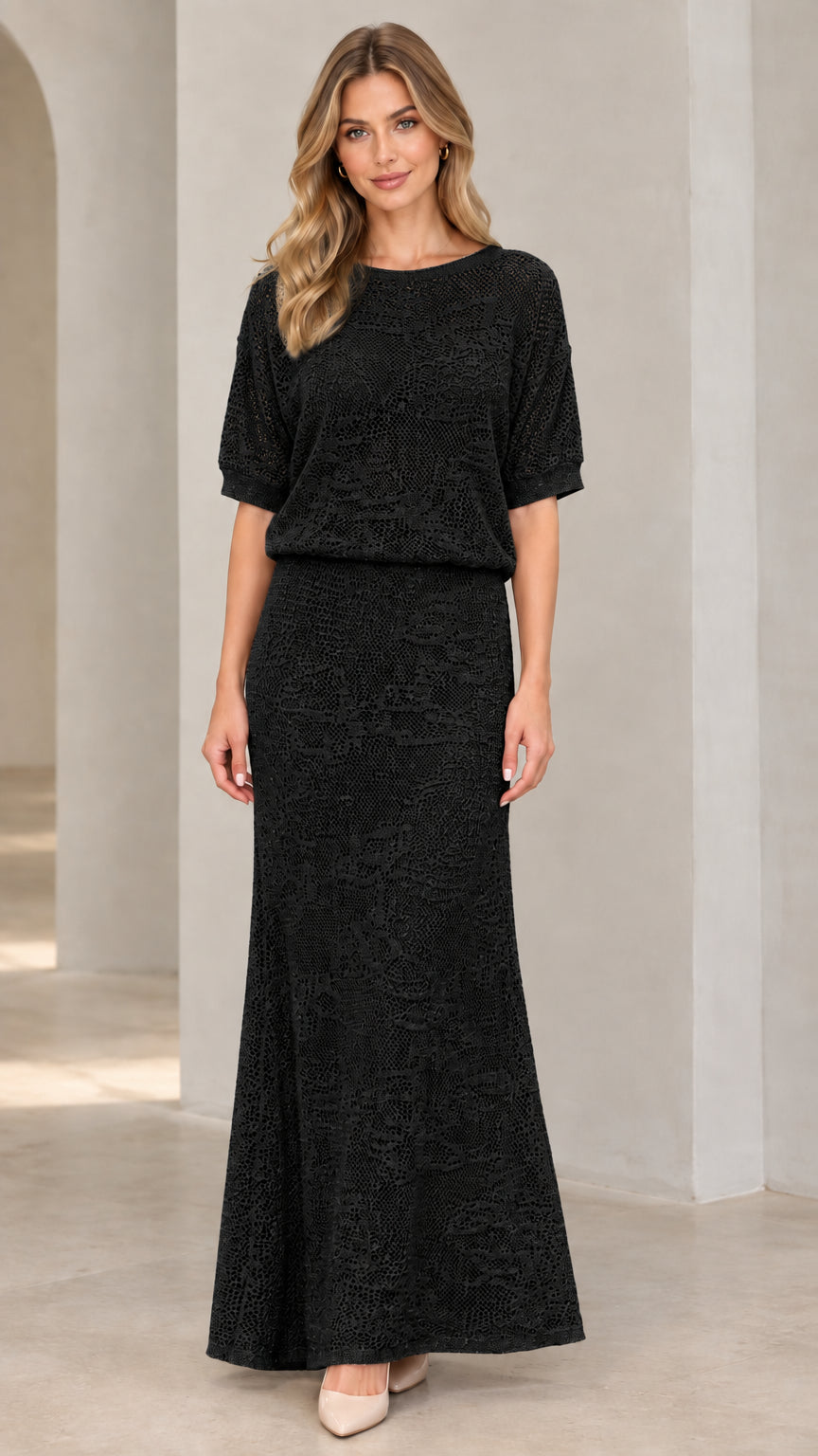 Front view of woman wearing black crochet knit blouson maxi dress