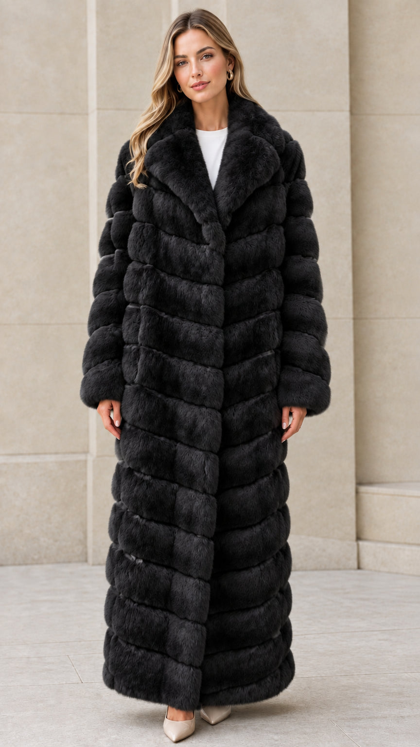 Front full-length view of model wearing Black chevron maxi faux fur coat