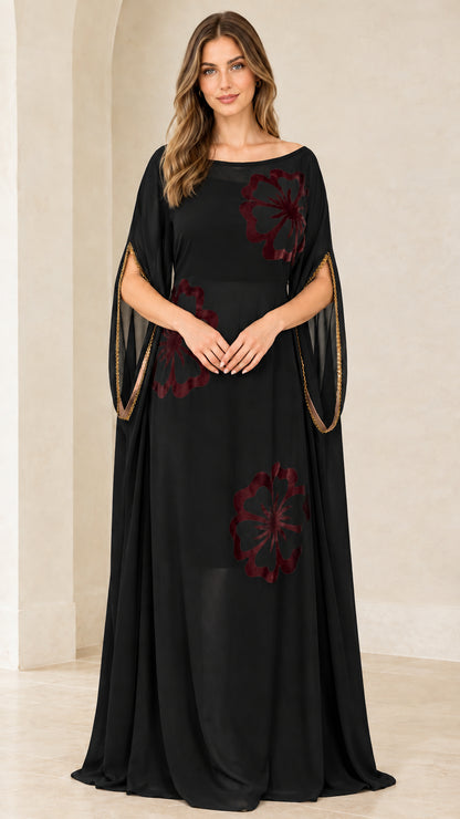 Front view of model wearing Classic Black floral applique kaftan maxi gown