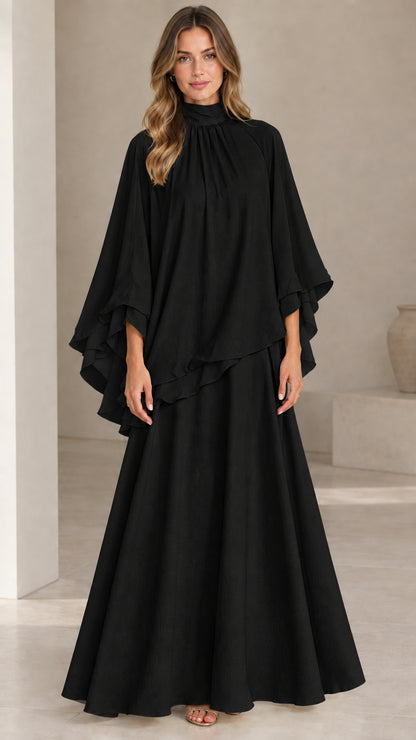 Front full-length view of model wearing classic black high neck capelet maxi dress set