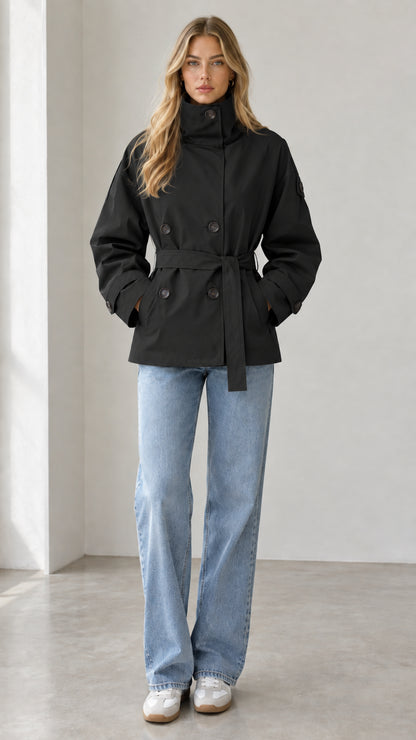 Model wearing classic black double-breasted short belted trench coat