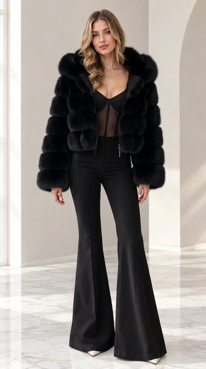 Model wearing black cropped hooded faux fur jacket with matching black pants