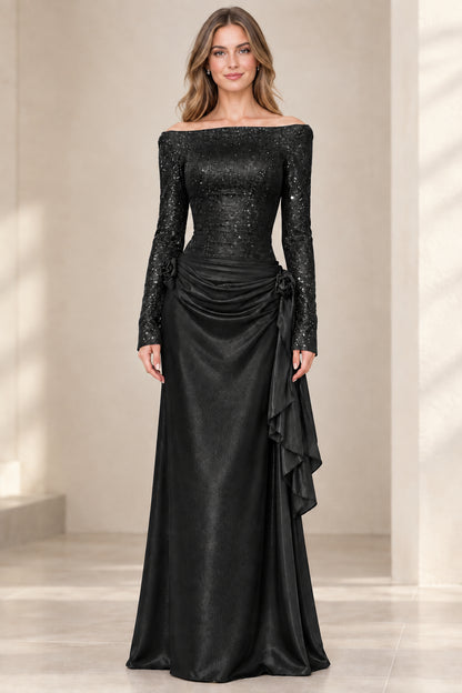 Model wearing Black off-the-shoulder long sleeve shimmer evening dress