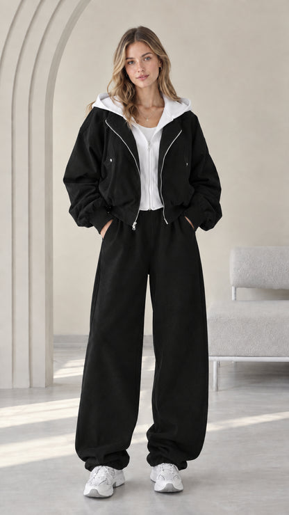 Front view of model wearing the Black contrast hooded zip jacket and wide-leg pants set