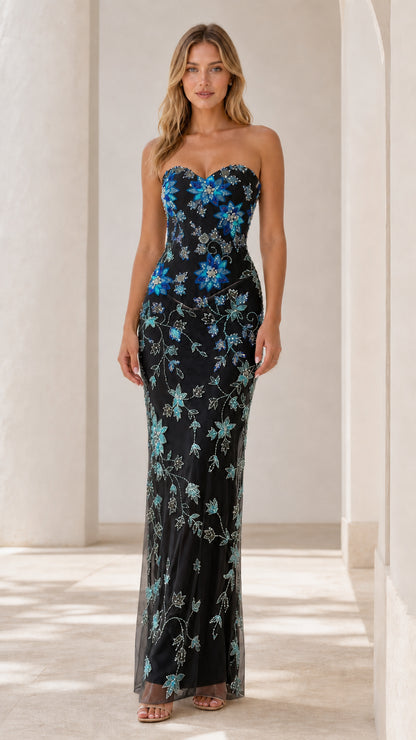 Front view of black strapless evening dress with blue floral beadwork