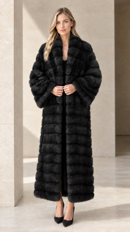 Model wearing black horizontal paneled faux fur maxi coat