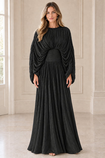Front view of model wearing Black pleated draped cape sleeve formal maxi dress