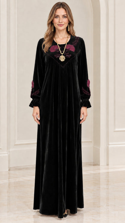 Front view of black velvet maxi dress with embroidered yoke
