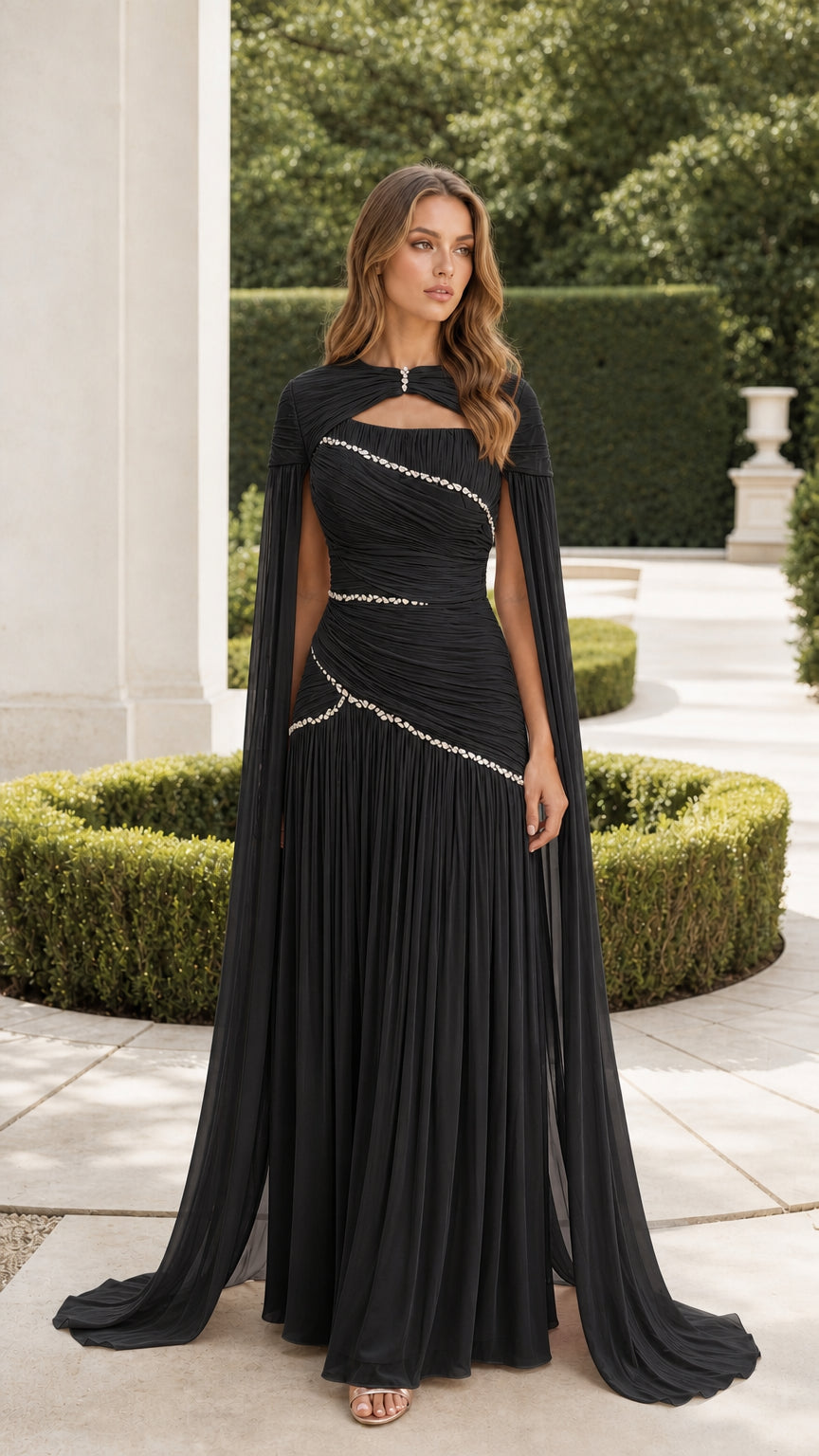 Black floor-length evening gown with attached cape sleeves and crystal waist beading