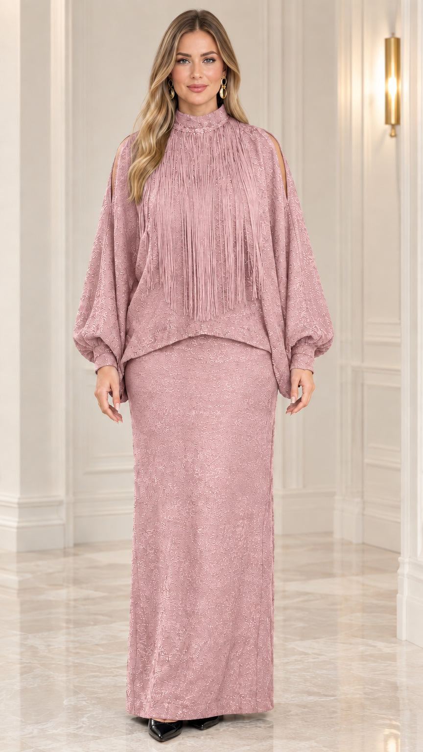 Front view of model wearing dusty pink fringe mock neck two-piece maxi dress set