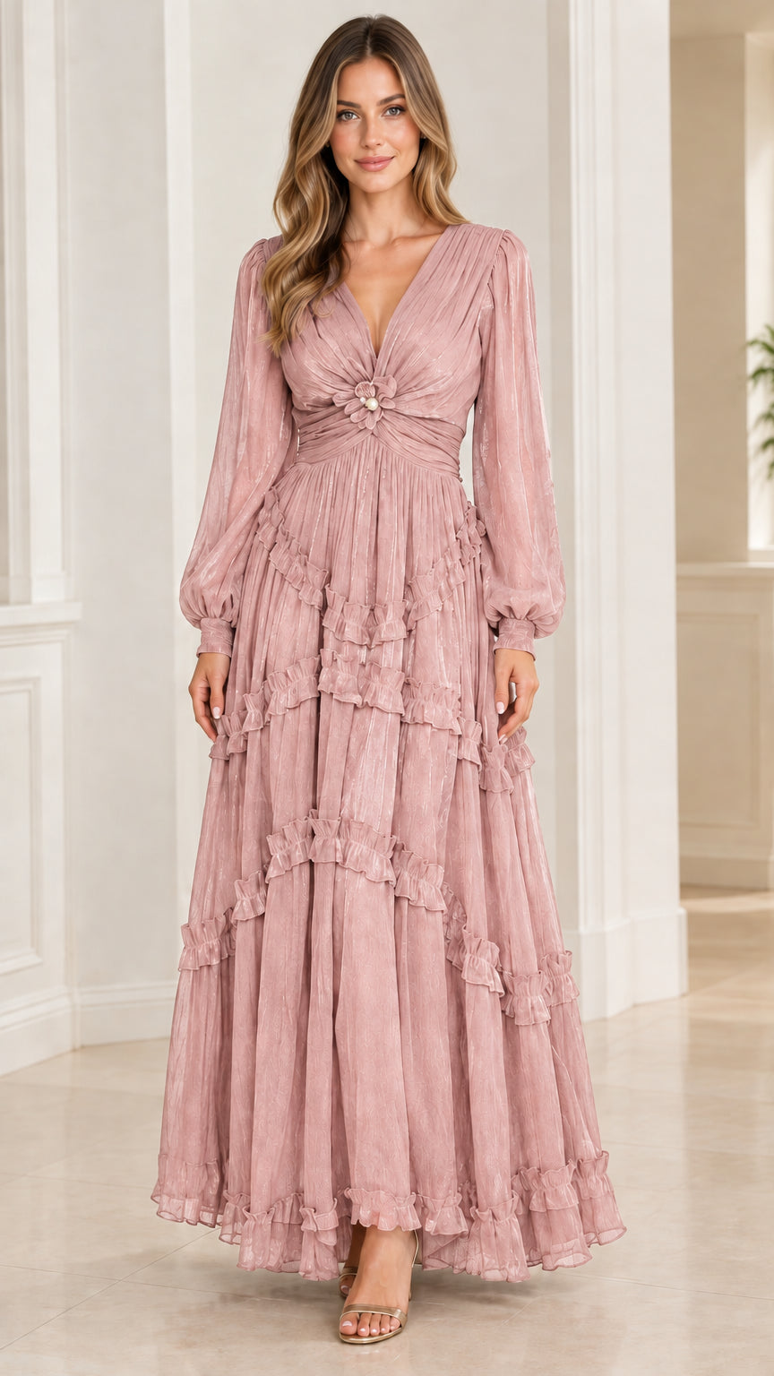 Model wearing dusty rose pink plissé tiered maxi gown with bishop sleeves