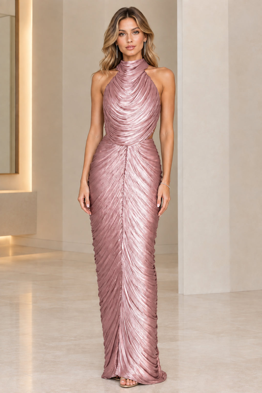 Model wearing rose pink metallic pleated halter maxi formal dress