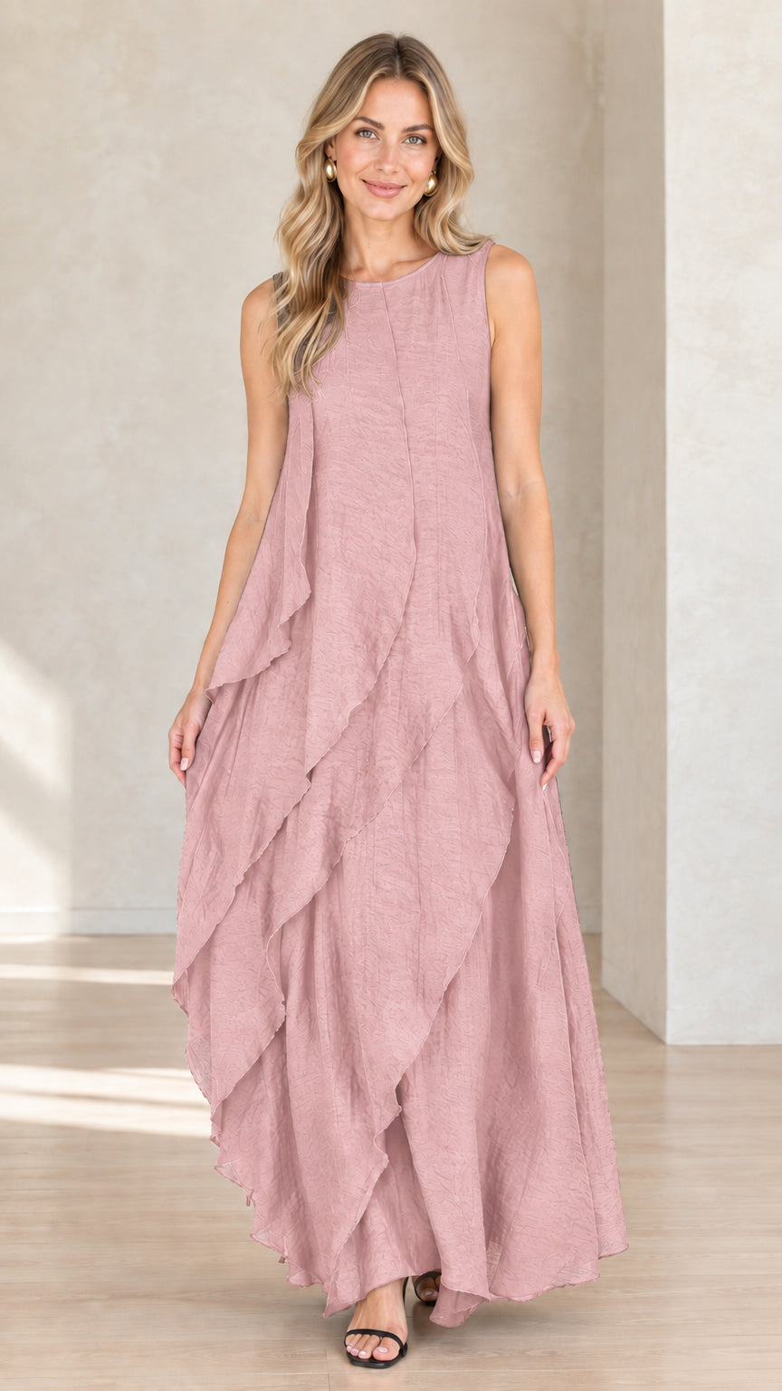 Model wearing dusty pink sleeveless tiered ruffled maxi dress