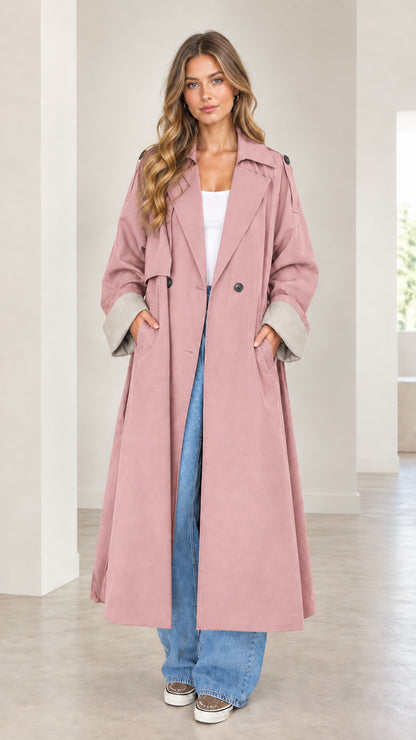 Front full-length view of woman wearing the dusty pink oversized maxi trench coat