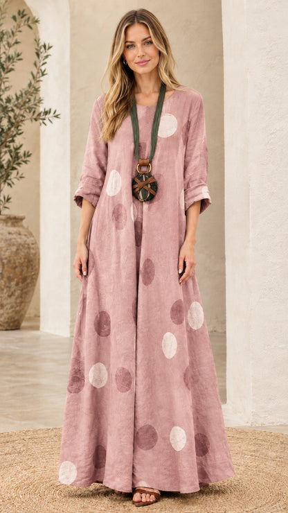Woman wearing dusty pink polka dot relaxed fit maxi dress