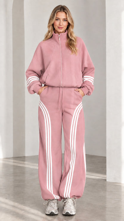Front view of woman wearing dusty pink two-piece striped tracksuit set