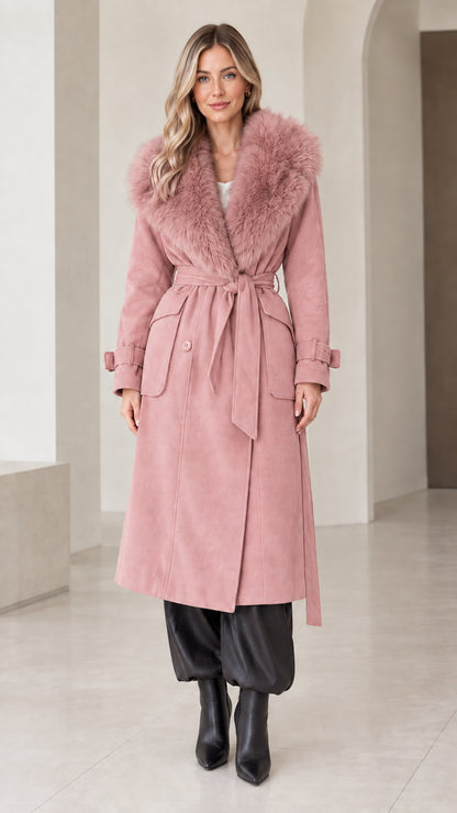 Front view of model wearing dusty pink belted long coat with plush faux fur collar