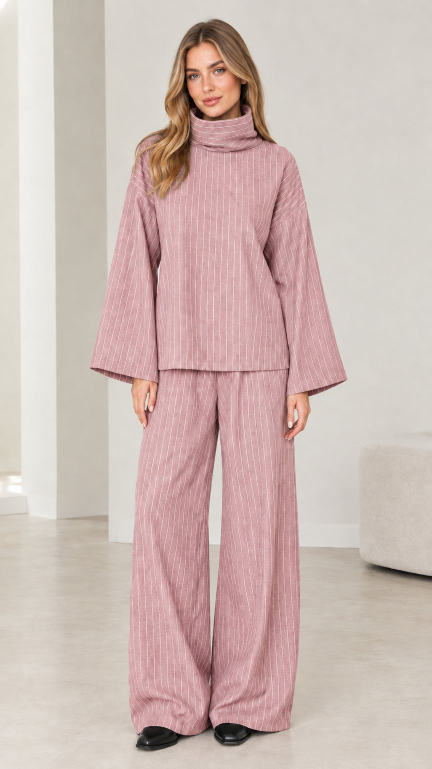 Woman wearing Dusty Pink pinstripe turtleneck and wide-leg pants two-piece set