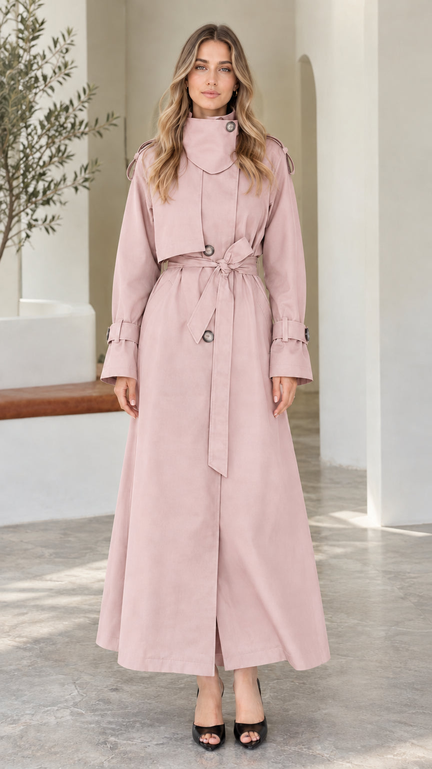 Front view of model wearing Dusty Pink high-neck maxi belted trench coat