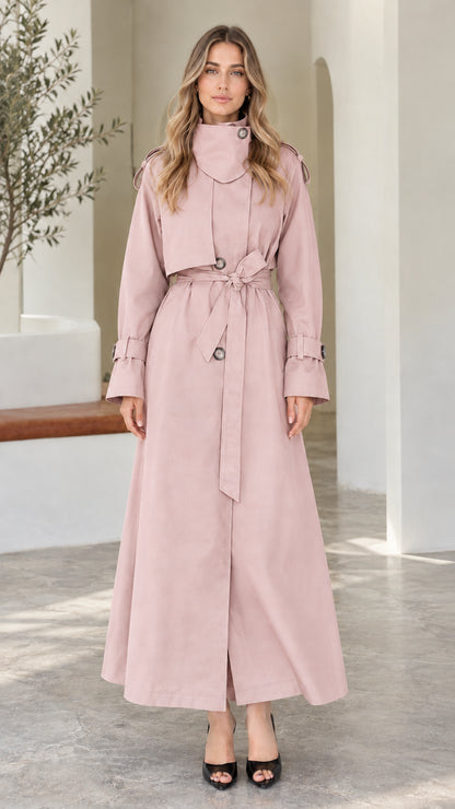 Front view of model wearing Dusty Pink high-neck maxi belted trench coat